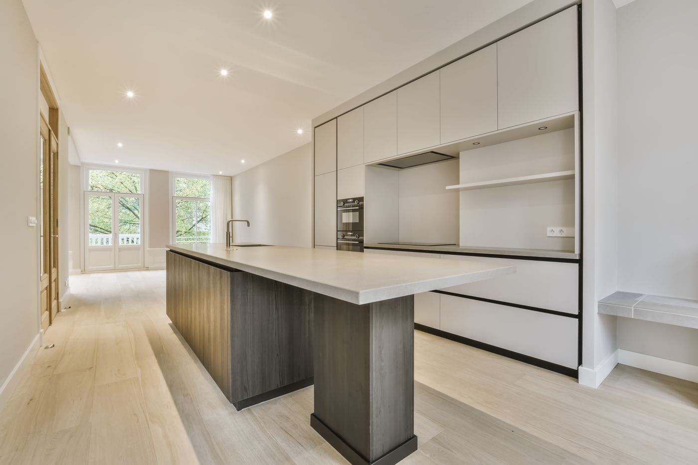 Open-plan kitchen with an island, finished to a high standard