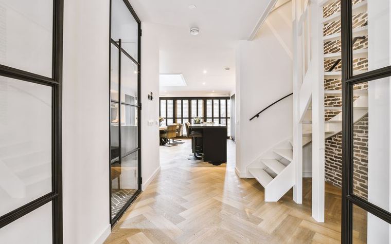 Refurbished interior with herringbone wood flooring